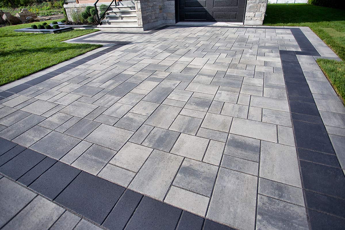 Eco Friendly Driveway | Driveway with stone pattern in front of house | Beausoleil & Sons Paving Services